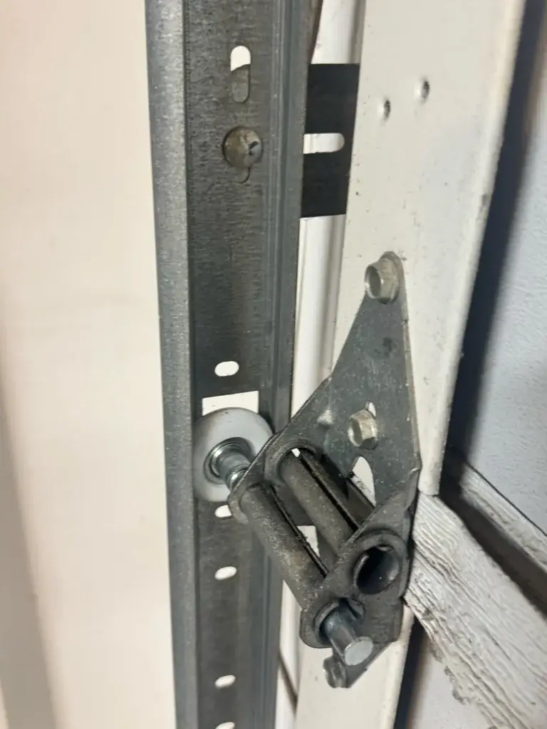garage door cable, drum, and track hardware inspected during service, real company service photo 1